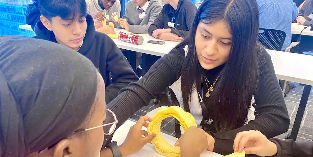 iDEW students at Google HQ in Chicago work on a challenge project using potato chips