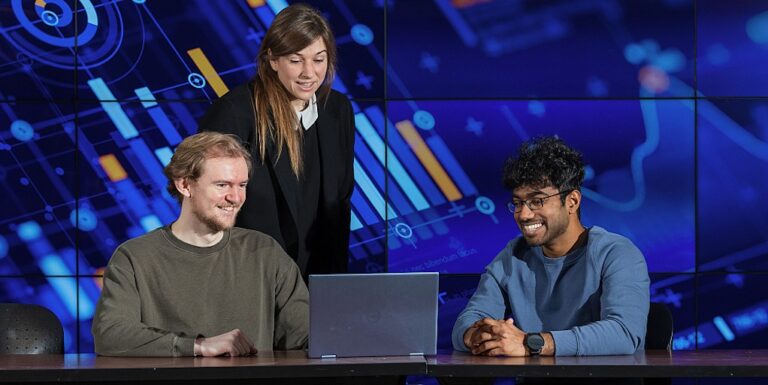 Sports Analytics Associate Professor Liz Wanless with Sports Analytics students Elliott Scott (l) and Anurag Reddeddy (r).