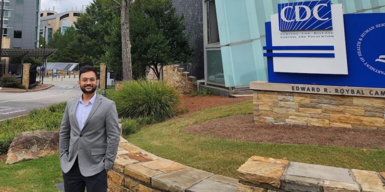 Health Informatics alumnus Shikhar Shukla poses outside in front of CDC building.