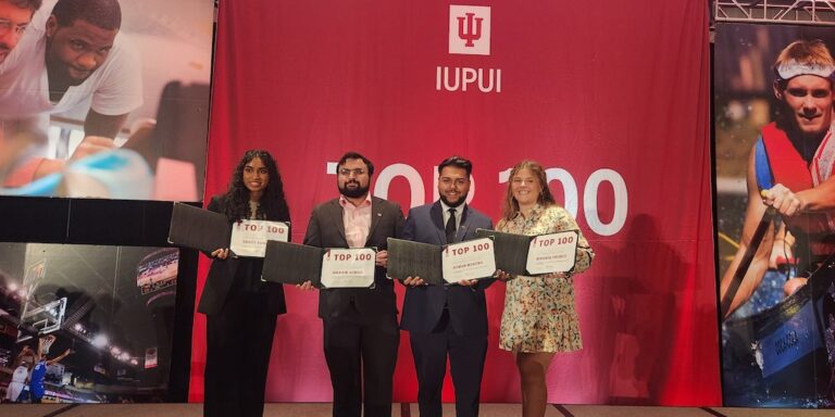Four students holding certificates at 2024 IUPUI Top 100 ceremony
