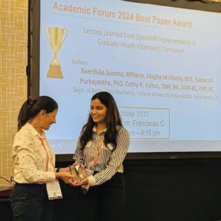 Health Informatics student Keerthika Sunchu receiving AMIA Symposium Best Paper Award